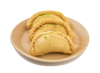 Gujiya or Gujia is a indian sweet dumpling made with suji, Maida or wheat flour and stuffed with khoya. It is common in North India, particularly in Bihar, Uttar Pradesh, Madhya Pradesh or Rajasthan