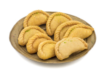 Gujiya or Gujia is a indian sweet dumpling made with suji, Maida or wheat flour and stuffed with khoya. It is common in North India, particularly in Bihar, Uttar Pradesh, Madhya Pradesh or Rajasthan