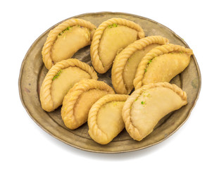 Gujiya or Gujia is a indian sweet dumpling made with suji, Maida or wheat flour and stuffed with khoya. It is common in North India, particularly in Bihar, Uttar Pradesh, Madhya Pradesh or Rajasthan