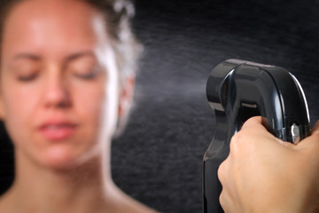 Woman body paint with airbrush