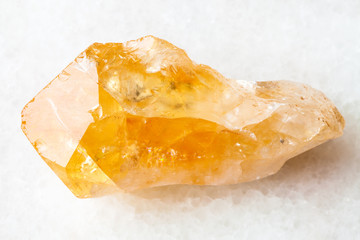 raw crystal of Citrine gemstone on white