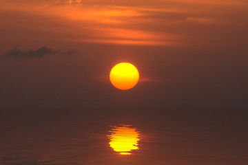 Big sun reflection on the water