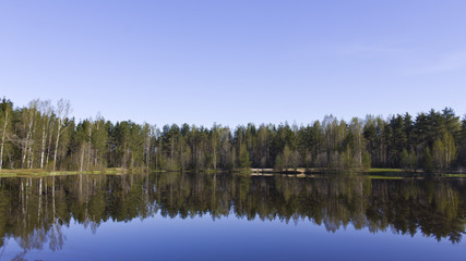 Fototapeta na wymiar Lake in a calm morning