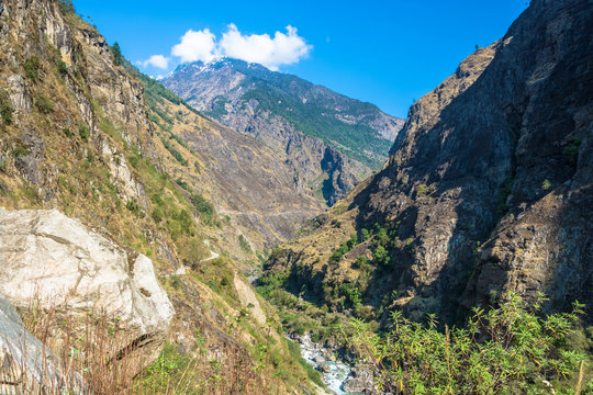 Mountain landscape with a deep gorge in the Himalayas.