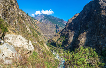 Mountain landscape with a deep gorge in the Himalayas.