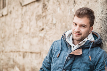 Portrait of young handsome man looking, outdoor, outside.