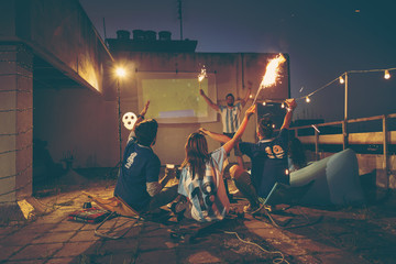 Football fans cheering for their team