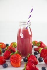 Berry Fruit Smoothy on a White Wood Table