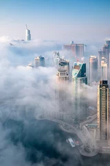 Foto auf Acrylglas Dubai skyline, aerial top view of the city in Dubai Marina on a foggy day © Monica