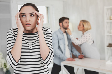 I am tired. Cheerless young woman rolling her eyes while feeling angry