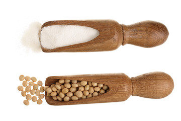 soybeans and dried soy milk in wooden scoop isolated on white background top view