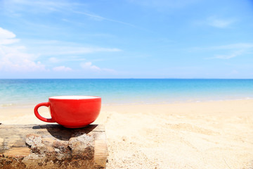 Red Coffee Cup on the beach minimal style and Copy space