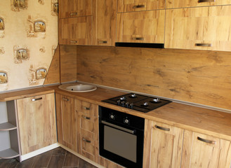 Country style wooden kitchen. The interior design of the dining room. 