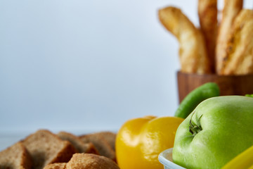 Ingredients for school lunch and plastic container on the table, close-up, selective focus