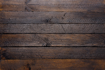 Wooden texture of dark wood planks top view