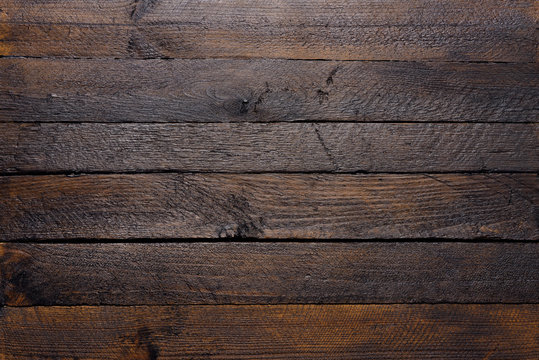 Fototapeta Wooden texture of dark wood planks top view