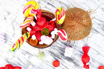 Many different candies in coconut