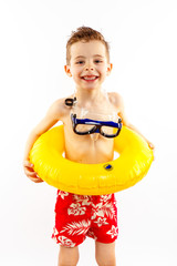 Baby boy portrait with swimming accessories on white backgroung.
