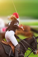 Deurstickers Polo woman player is riding on a horse. © Lukas Gojda