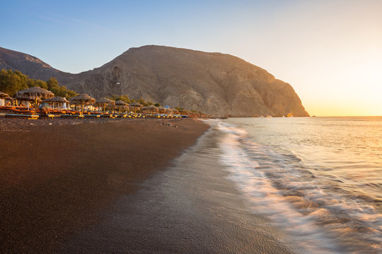 Perissa beach during sunrise on the Greek island of Santorini.