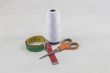 thread, scissors and tape