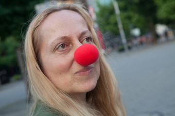 Woman with clown nose.