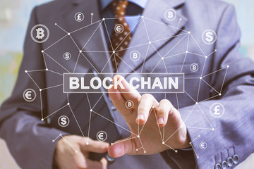 Businessman presses button blockchain on virtual web digital electronic user interface