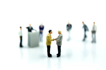 Miniature people : Businessman Leads Meeting Conference Discussion Corporate Concept.
