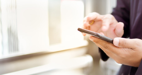 Businessman asian using phone for celling and texting on her mobile phone