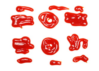 Red ketchup spreading, splashes isolated on white background, tomato pure texture, top view