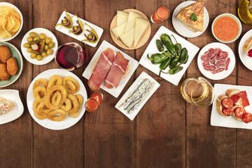 Spanish tapas food on dark background with place for text