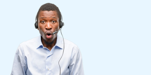 Black man consultant of call center scared in shock, expressing panic and fear