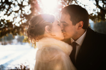 Lovers bride and groom on their winter wedding