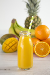Tropical Fruit Smoothy on a White Wood Table