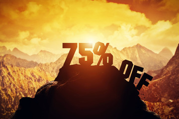 75% off writing on a mountain peak.