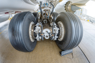 Wheels rubber tire rear landing gear racks, under wing view. - obrazy, fototapety, plakaty