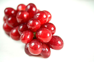 Bunch of ripe red grapes isolated on white