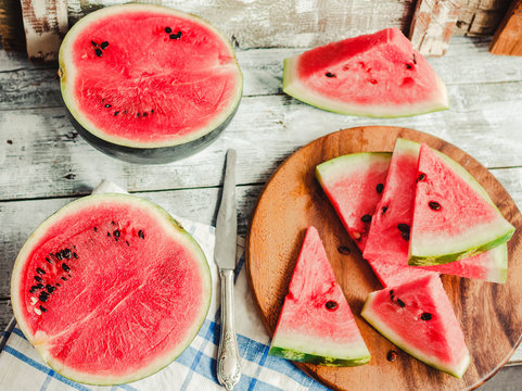 Fresh sliced watermelon on blue a wooden background.Detox diet and healthy food concept.Top view.
