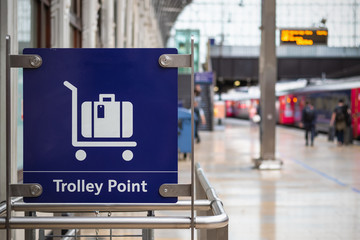 Select focus, sign of trolley point at Paddington railway station in London