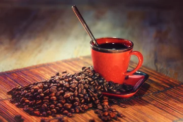 Foto auf Leinwand Kaffeebohnen mit roter Tasse © guy
