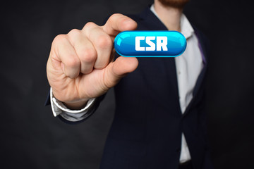 A businessman shows an inscription:CSR