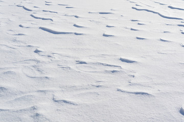 texture of the waves of snow, inflated snow in the form of zigzags