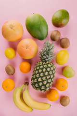 Exotic fruits on pink background