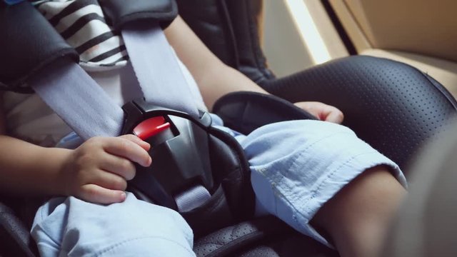 close-up child sitting on car seat