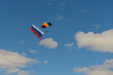 May 9, 2018: A paratrooper with the flag of Russia descends to the ground. Cheboksary. Russia.