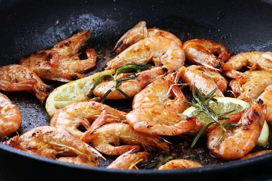 Grilled shrimp skewers. Seafood, shelfish. Shrimps Prawns skewers with herbs, garlic and lemon.