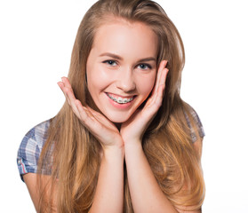 Portrait of teen girl showing dental braces.