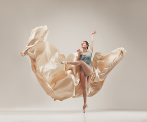 Modern ballet dancer dancing in full body on white studio background. - obrazy, fototapety, plakaty