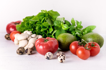 Healthy Diet Food on White Background Vegetables Tomatoes Peppers Green leaves Mushrooms Eggs Diet Food Concept Ingredients for Salad