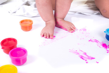 closeup painted in bright colors feet. isolated on white background